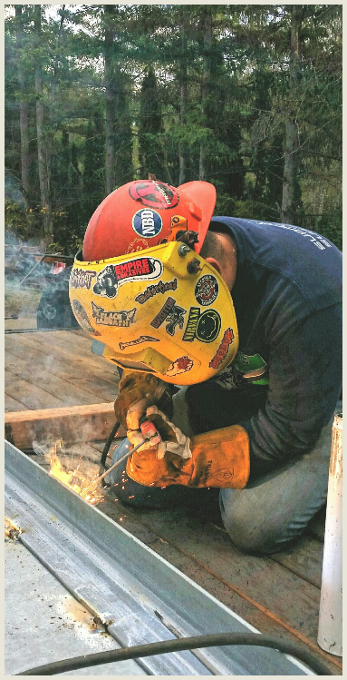 Man Welding a Beam